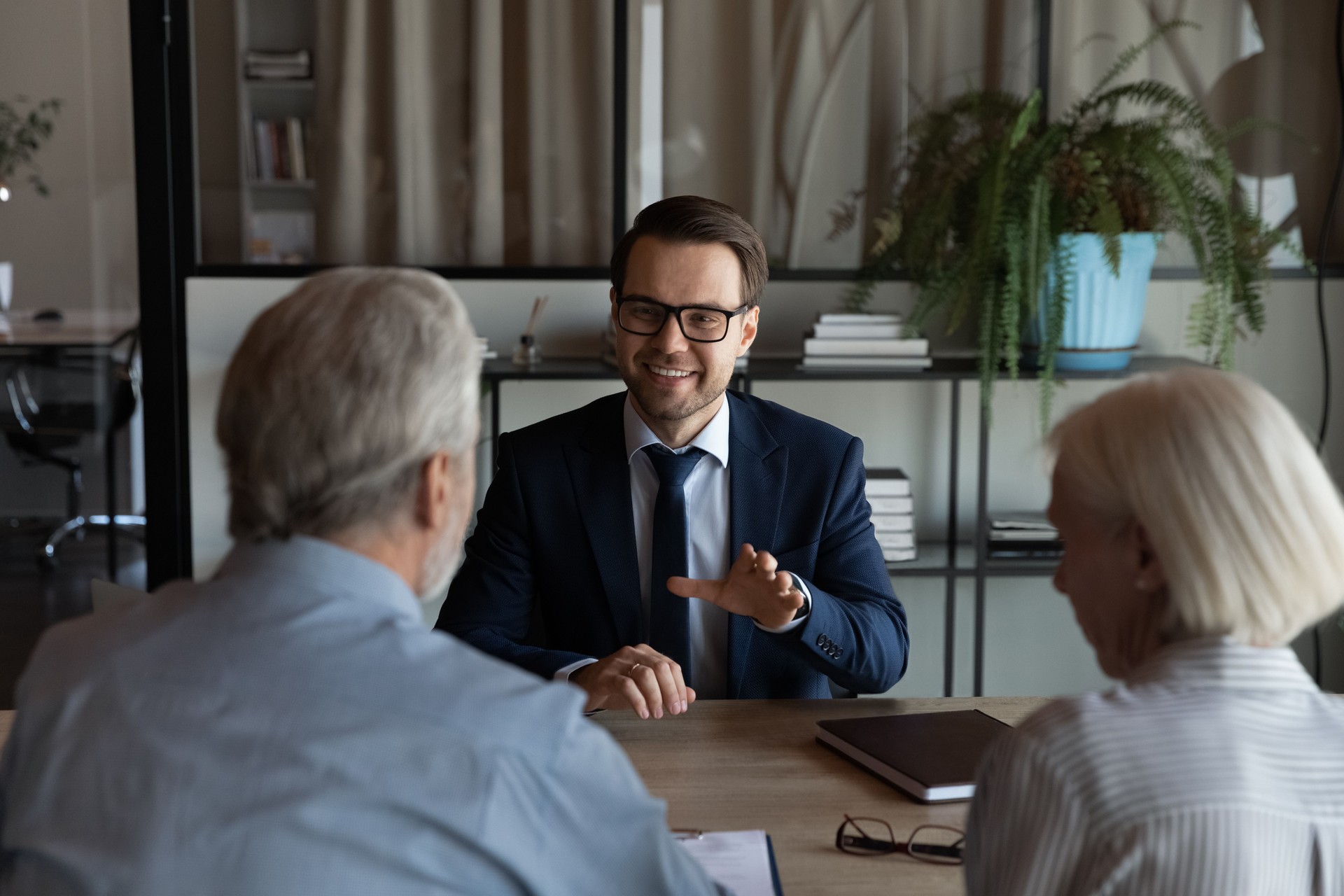 Happy confident lawyer, Real Estate Agent, notary, financial advisor giving consultation